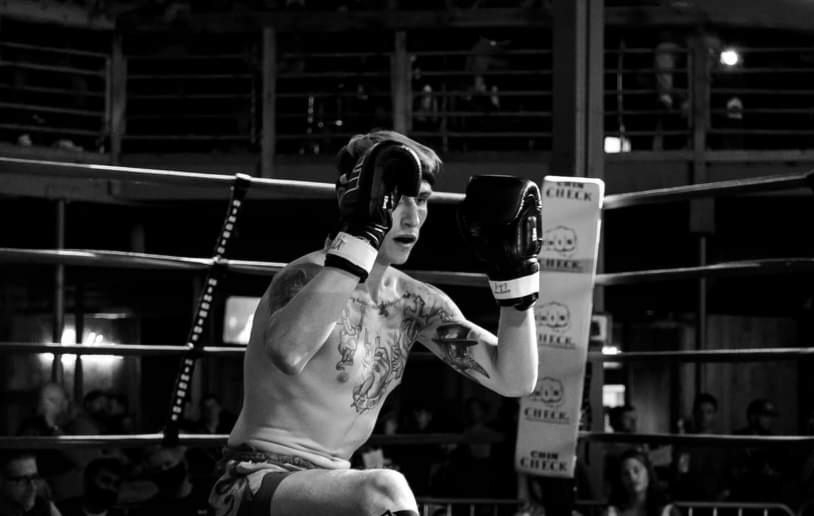 81's Fight Club fighter standing in the ring in a guarded stance.